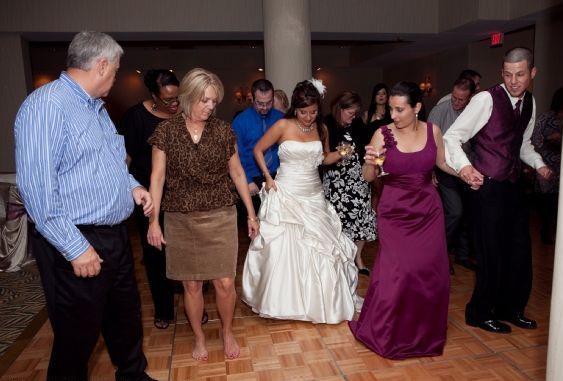 Wedding Review - Alpha Prosperity Events, Happy wedding clients, dancing bride, Missouri City Wedding Planner, Hilton Nasa Clear Lake, wedding reception,